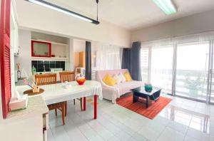 a living room with a couch and a table at Cozy 1br walk to BTS and Airport Rail Link Close to Malls T in Bangkok