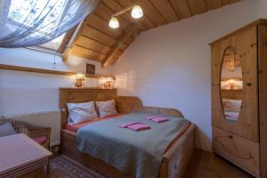 a bedroom with a bed with pink towels on it at Penzion Vinicky dvůr in Kaplice +93 photos