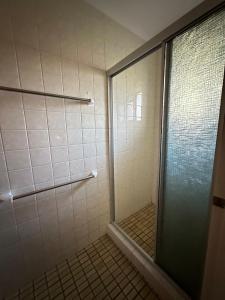 a shower with a glass door in a bathroom at Casa Sarina in Stanthorpe +10 photos