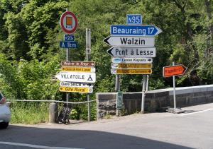 a bunch of street signs on the side of a road at Capstay Dinant in Dinant