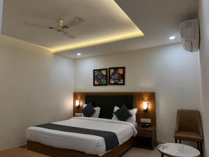 a bedroom with a large bed in a room at The Barrel House, Varanasi in Varanasi +12 photos