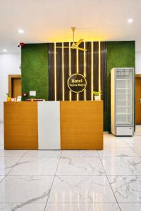 a lobby of a dental office with a reception desk at Hotel Venus Stays Near Prestige College Bhopal in Bhopal
