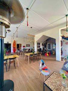 a room with tables and chairs in a building at Casa Biba in Utique