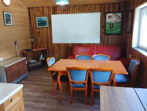 a dining room with a table and chairs at Vila Tijana in Žabljak