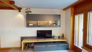 a kitchen with a sink and a counter at Haus Belstar A in Naters