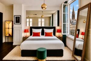 a bedroom with a bed with red pillows and a mirror at LIFE CATHEDRALE City-Center Place Gutenberg in Strasbourg