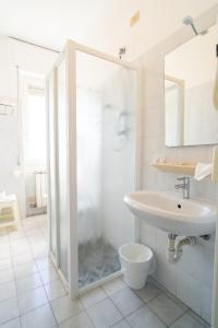 a bathroom with a shower and a sink at Hotel Corallo in Pietra Ligure +30 photos