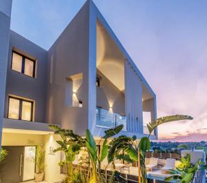 an exterior view of a house with plants at Calista Horizon by Booking Kottas in Kallithea Halkidikis +106 photos