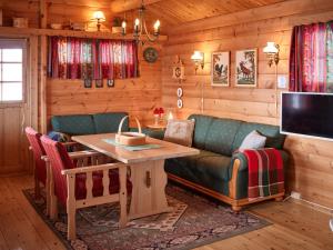 a living room with a couch and a table at Fjellro in Stranda