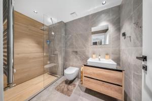 a bathroom with a shower and a toilet and a sink at BW Premium One-Bedroom Apartments in Belgrade +211 photos