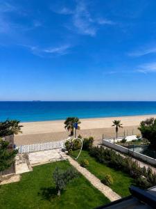 a view of the beach from the balcony of a condo at NOVA PORT Boutique Hotel in Tekirdağ