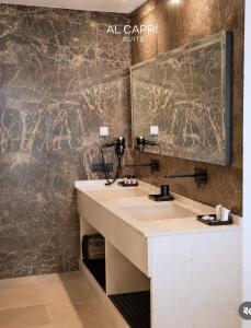 a bathroom with a sink and a mirror at Al Capri Suite & Private Pool in Capri +27 photos