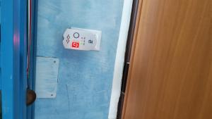a close up of a door with a sign on the wall at Casa Dina Blu alle Morge in Torino di Sangro