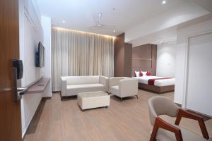 a living room with a couch and a bed at MOKSH SERENe in Shrīnagar