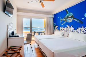 a bedroom with a bed with a shark on the wall at Mirador del Cabo Designed For Adults in Aguadulce