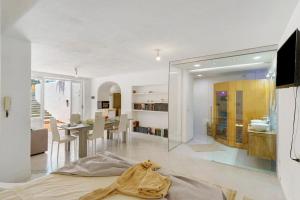 a living room and dining room with a large mirror at Casa Gio & Angie in Forio d'Ischia