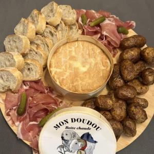 a plate of different types of meats and meatballs at Chambre d hotes Spa montagne in Laruns