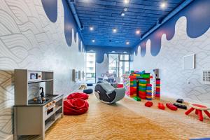 a childrens play room with a play set and a play equipment at Happy Land Aqua Polanki B405 in Kołobrzeg +34 photos