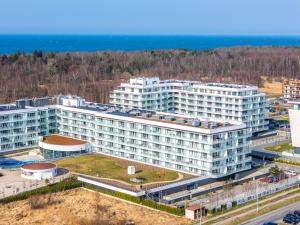 an aerial view of a large white building at Happy Land Aqua Polanki B405 in Kołobrzeg