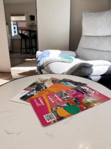 a table with a magazine on top of a table at Apartment am Innenstadtwall in Stadthagen
