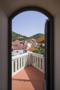 an open door to a balcony with a view at Feel Discovery Casa da Aldeia in Mós +12 photos