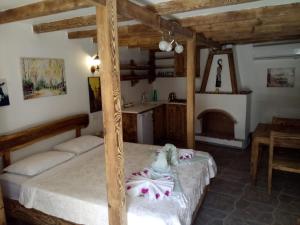 a bedroom with two beds and a fireplace at Karya Apartments in Koycegiz