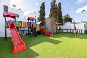 a playground with a slide and a slideintend at THB Royal in Playa Blanca