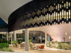 a rendering of the lobby of a hotel with a large ceiling at Mercure Rayong Lomtalay Villas & Resort in Mae Pim
