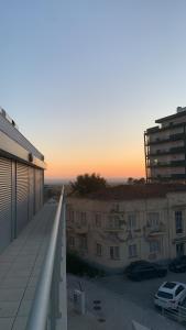 a view of a building from the balcony of a building at T1 Figueira da Foz in Buarcos