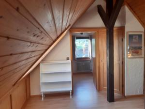 an attic room with a staircase and a window at Kopffrei auf 1000 m Wohnung 2 in Feldberg