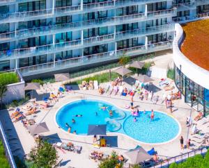 an aerial view of an apartment complex with a pool at Happy Land Aqua Polanki B407 in Kołobrzeg