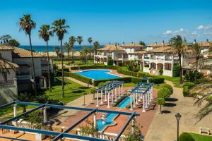 an aerial view of a resort with a swimming pool at Leo San Bruno in Isla Canela