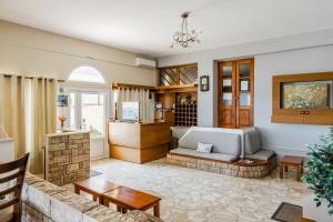 a living room with a couch and a table at Filoxenia Hotel Monemvasia in Monemvasia