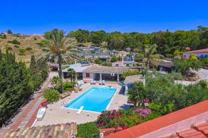 an aerial view of a resort with a swimming pool at Passione Mare in Porto Palo