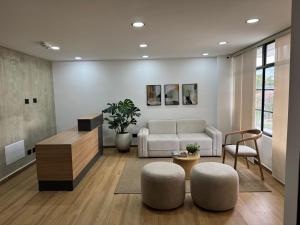 a living room with a couch and a table at TokioLiving in Armenia