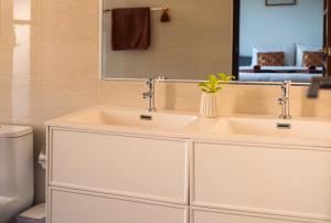 a bathroom with two sinks and a mirror at Sam Lanta in Ko Lanta +72 photos