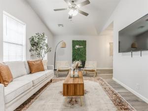 a living room with a couch and a table at Oak & Elm 2BR King & Queen Edmond, OK in Edmond