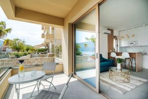 a balcony with a table and a view of the ocean at Adriatica sea view apartment in Baošići