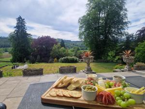 a tray of bread and other foods on a table at Sawrey House in Near Sawrey