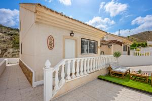 a villa with a staircase leading to a house at Casa Nemo in Rojales