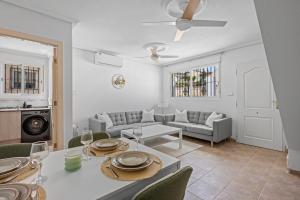 a living room with a table and a couch at Casa Nemo in Rojales