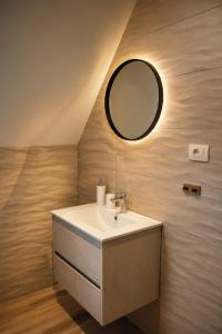 a bathroom with a sink and a mirror at Trebižat Oasis in Čapljina +20 photos