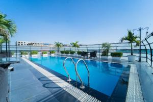 a swimming pool on the roof of a building at Hotel Bhaskar-Near Jaipur Airport in Jaipur