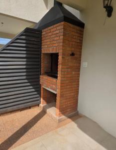 a brick oven in a room with a wall at Duplex en Luque in Zarate Isla