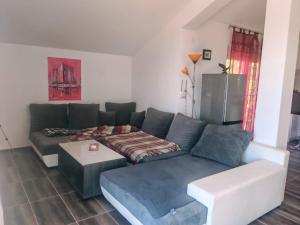 a living room with a couch and a table at Villa Yulia in Luštica