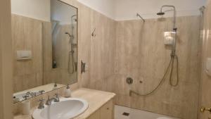 a bathroom with a sink and a shower at Piccinni house in Bari +28 photos