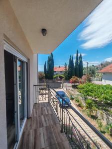 a balcony with a view of a yard at Villa Yulia in Luštica