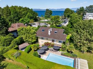 an aerial view of a house with a swimming pool at Villa Miroir in Publier