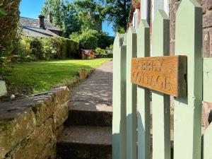 a sign on a fence that says baby justice at Abbey Cottage in St Bees