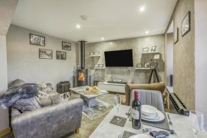 a living room with a couch and a table at 1 Bed in Banff oc-t42474 in Banff